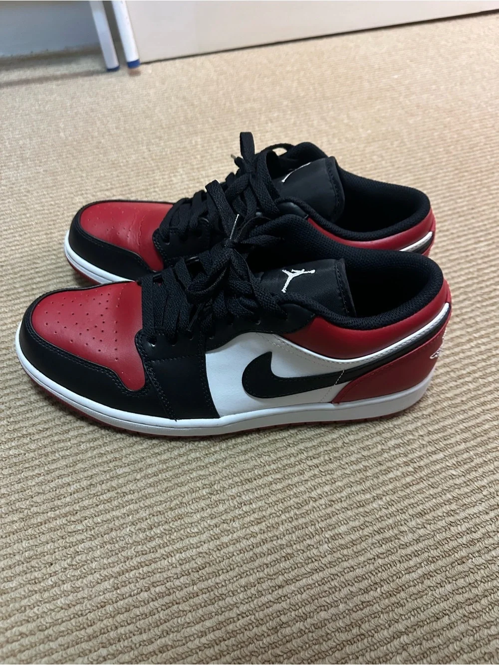 Jordan1 Men's Low-Top Sneakers in Black, Red & White